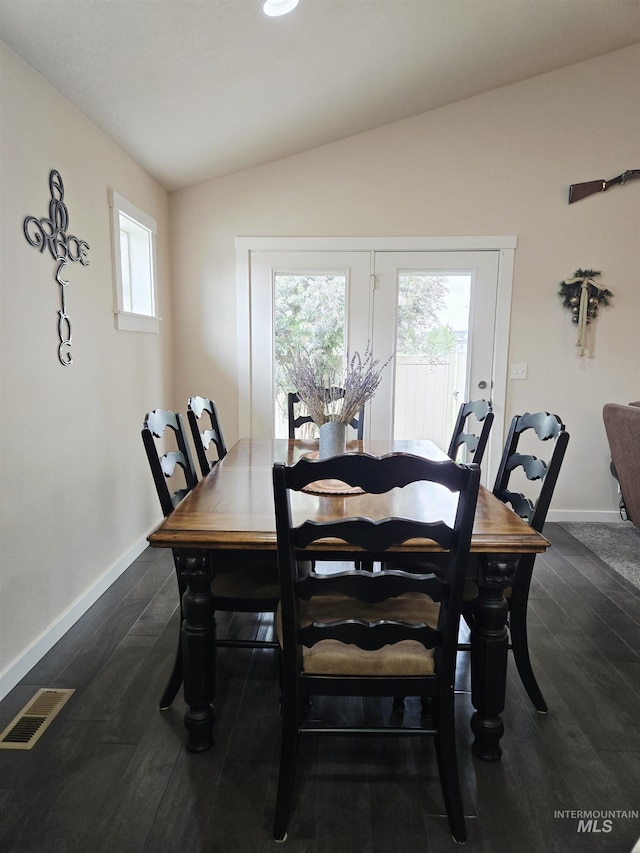 2716 Dogwood Ave, Fruitland, ID 83619 - dining space with vaulted ceiling, baseboards, and dark wood-style floors