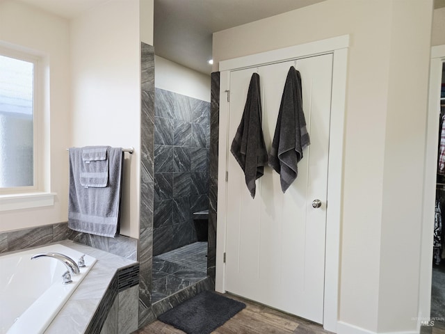 2716 Dogwood Ave, Fruitland, ID 83619 - full bathroom with a bath, walk in shower, and wood finished floors