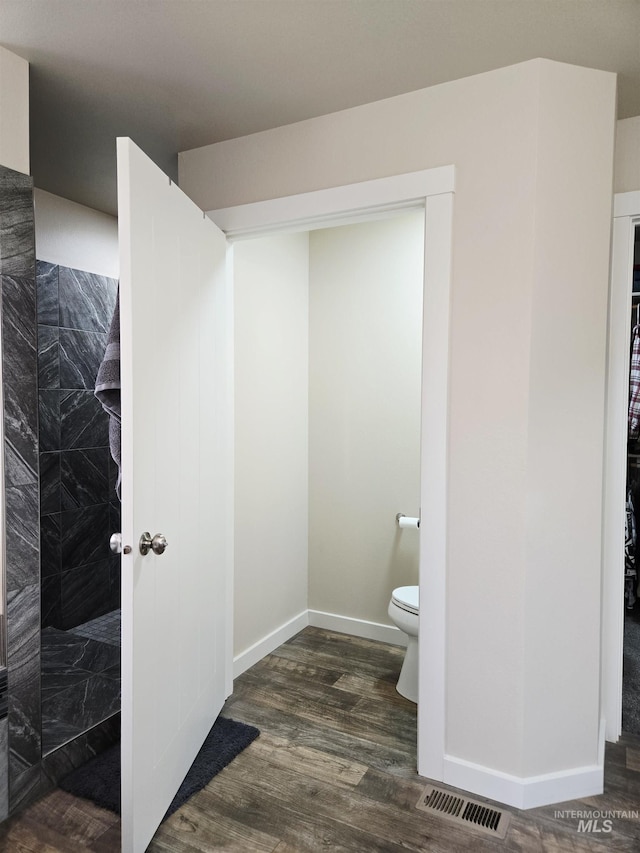 2716 Dogwood Ave, Fruitland, ID 83619 - full bath featuring toilet, walk in shower, wood finished floors, and baseboards