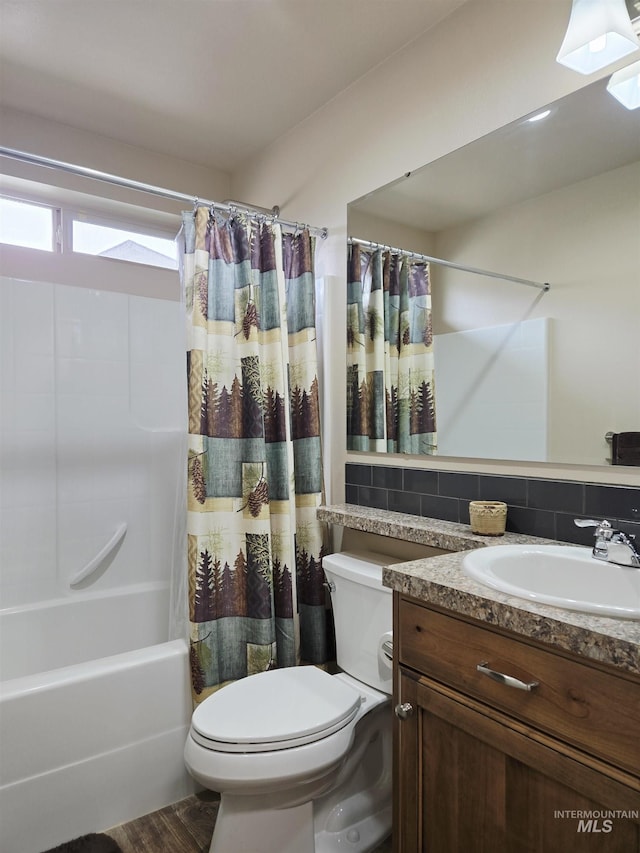 2716 Dogwood Ave, Fruitland, ID 83619 - full bath featuring toilet, vanity, shower / tub combo with curtain, a skylight, and decorative backsplash
