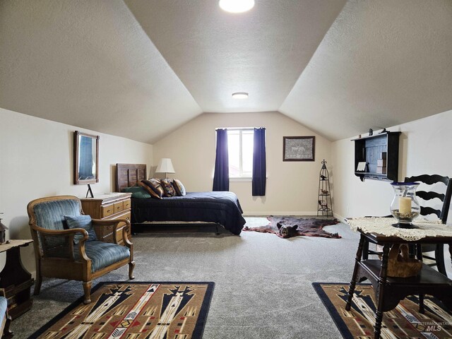 2716 Dogwood Ave, Fruitland, ID 83619 - bedroom with carpet flooring, vaulted ceiling, a textured ceiling, and baseboards