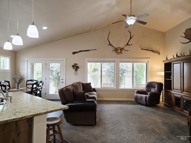 2716 Dogwood Ave, Fruitland, ID 83619 - living room with dark carpet, baseboards, ceiling fan, and high vaulted ceiling