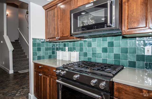 kitchen featuring backsplash and high end stainless steel range