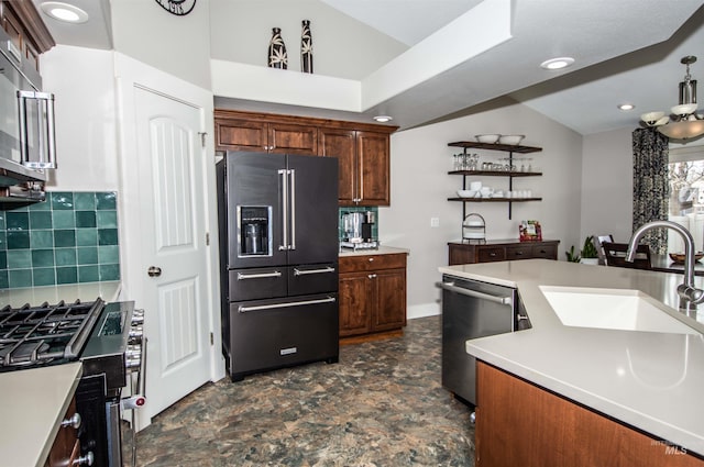 kitchen featuring sink, stainless steel appliances, and decorative backsplash