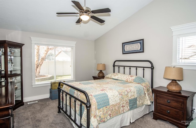 bedroom with ceiling fan, vaulted ceiling, and carpet