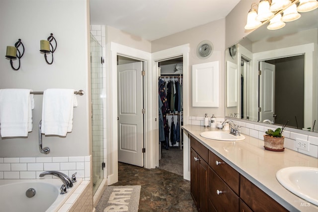 bathroom with shower with separate bathtub and vanity