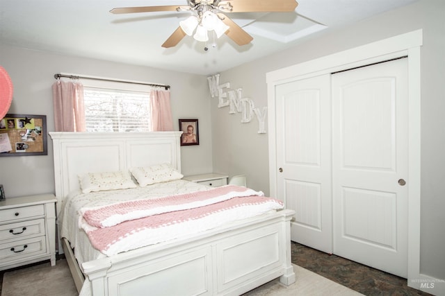 bedroom with ceiling fan and a closet