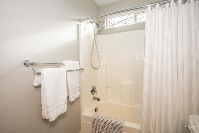 bathroom featuring shower / bathtub combination with curtain