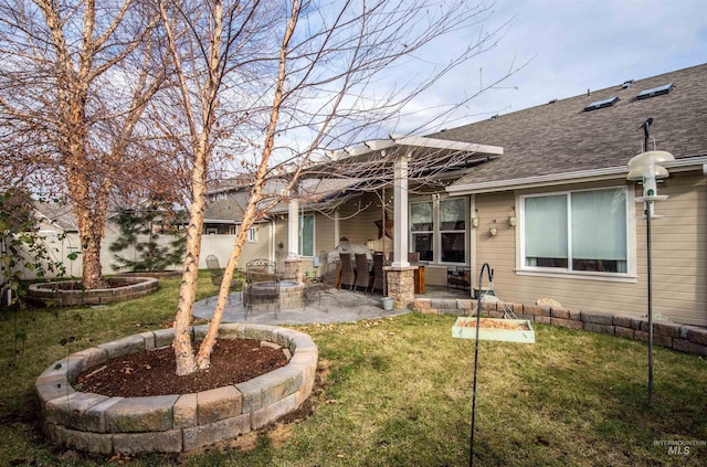 back of property featuring an outdoor fire pit, a patio area, and a yard