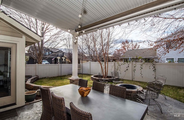 view of patio with an outdoor fire pit