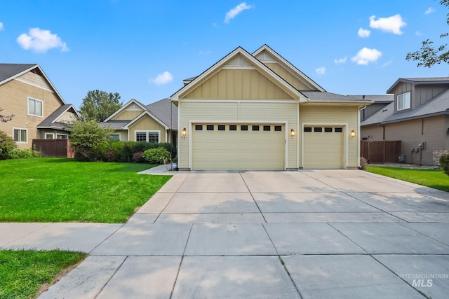 craftsman-style home featuring a front yard and a garage