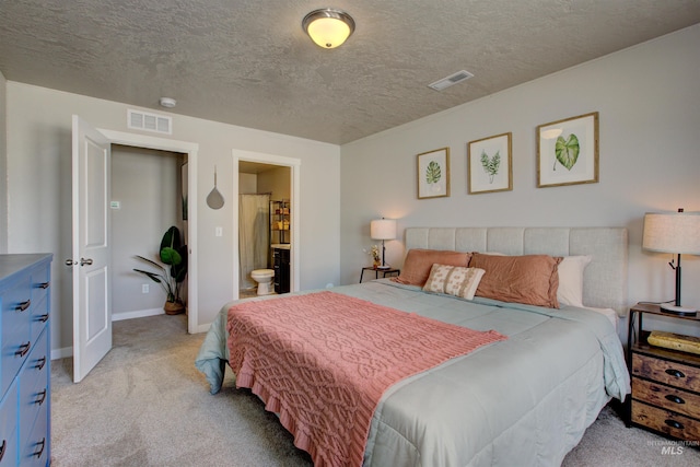 bedroom featuring visible vents, light carpet, a textured ceiling, and baseboards