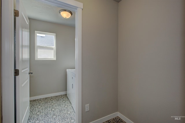 laundry room with washer and dryer, laundry area, and baseboards