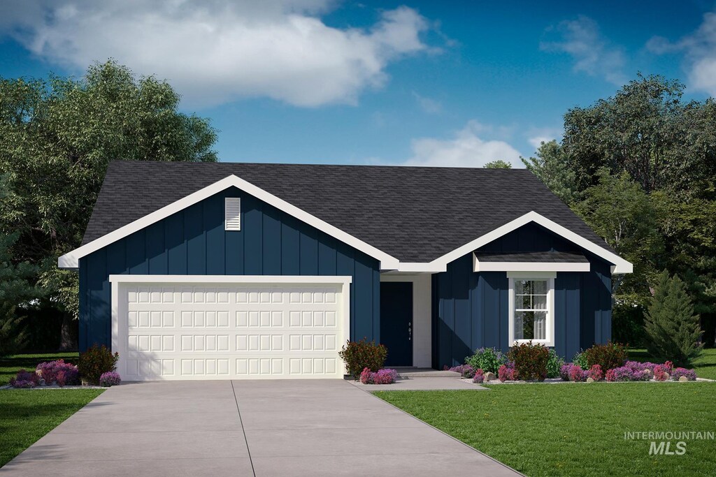 7673 E Edison St, Nampa, ID 83687 - single story home with board and batten siding, a shingled roof, and a garage