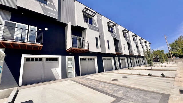 1011 S Orchard St Unit 101, Boise, ID 83714 - view of property with driveway and an attached garage