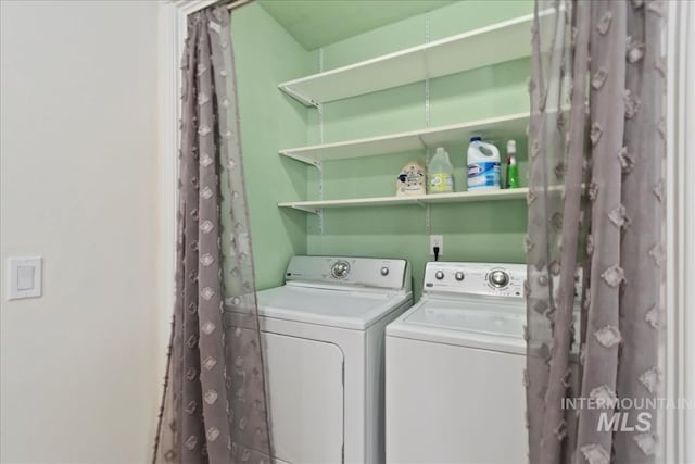 laundry area featuring washer and clothes dryer and laundry area