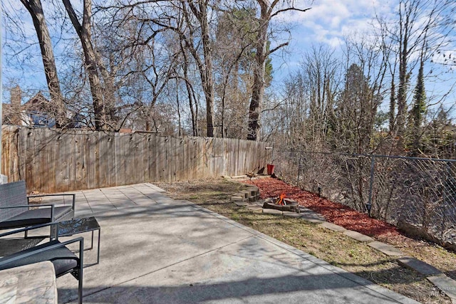 view of patio / terrace with a fenced backyard and an outdoor fire pit