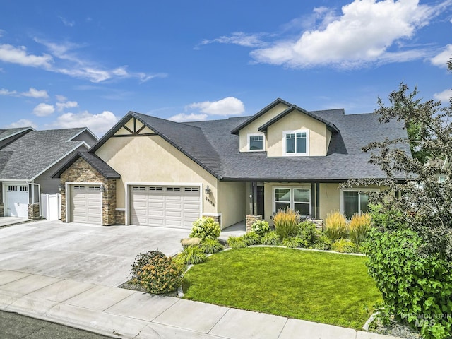 view of front of house featuring a garage and a front yard