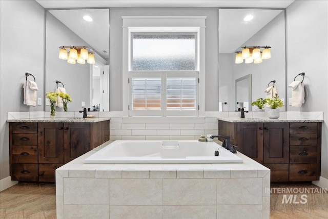 92 S Wildgrass Way, Star, ID 83669 - full bath featuring a bath, vanity, recessed lighting, and baseboards