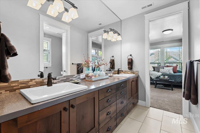 92 S Wildgrass Way, Star, ID 83669 - bathroom featuring double vanity, ensuite bath, a chandelier, and plenty of natural light