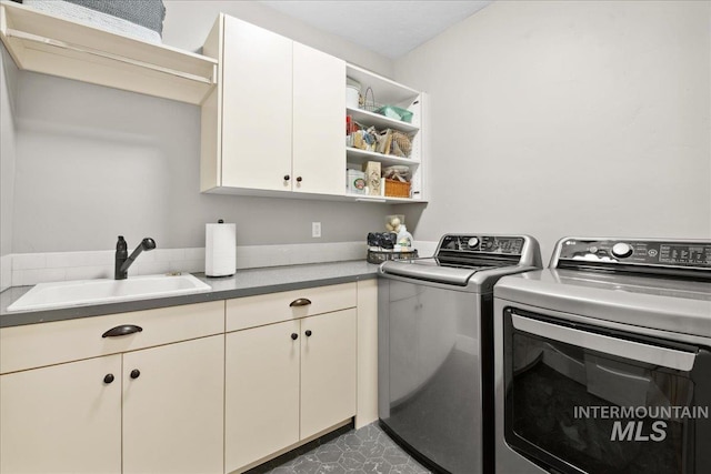 92 S Wildgrass Way, Star, ID 83669 - laundry area with washer and clothes dryer and cabinet space