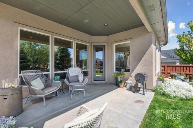 92 S Wildgrass Way, Star, ID 83669 - view of patio / terrace featuring an outdoor fire pit