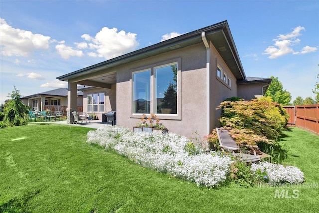 92 S Wildgrass Way, Star, ID 83669 - back of house with a patio area and stucco siding