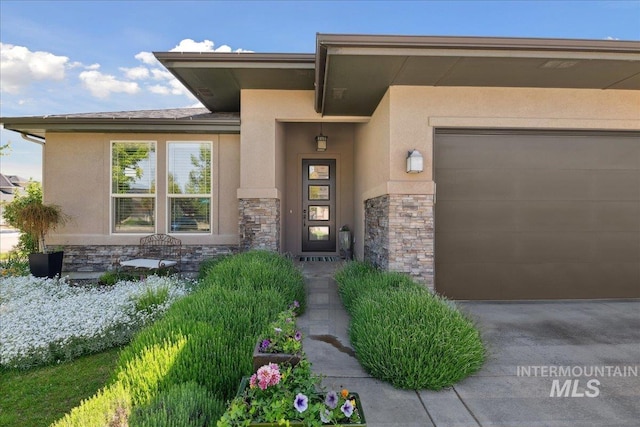 92 S Wildgrass Way, Star, ID 83669 - entrance to property featuring stucco siding, stone siding, and a garage