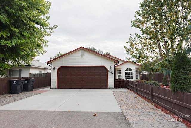 single story home with a garage