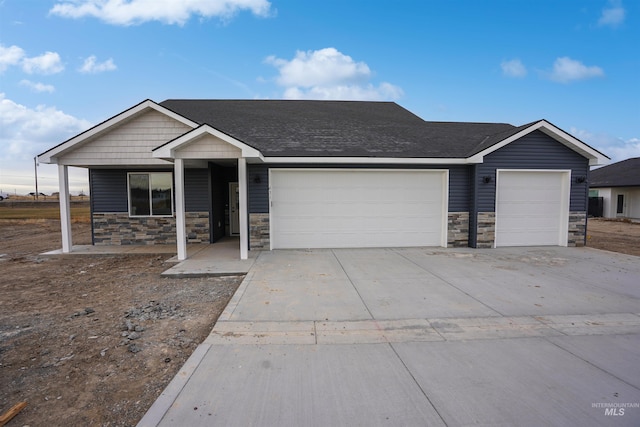 view of front of home featuring a garage and covered porch