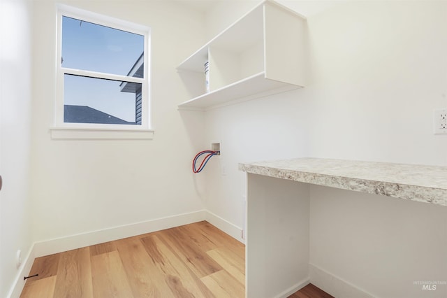 laundry room with hookup for a washing machine and light wood-type flooring