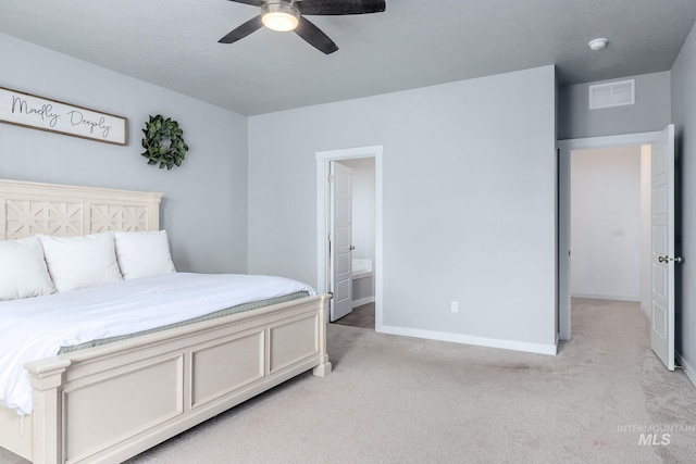 bedroom featuring connected bathroom, light colored carpet, a ceiling fan, baseboards, and visible vents