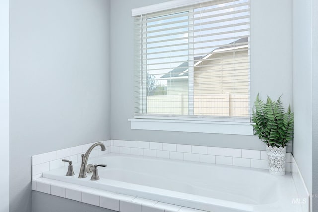 bathroom with a bath and a wealth of natural light