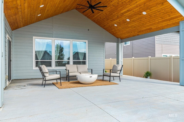 view of patio / terrace with an outdoor living space, ceiling fan, and fence