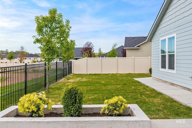 view of yard with a fenced backyard