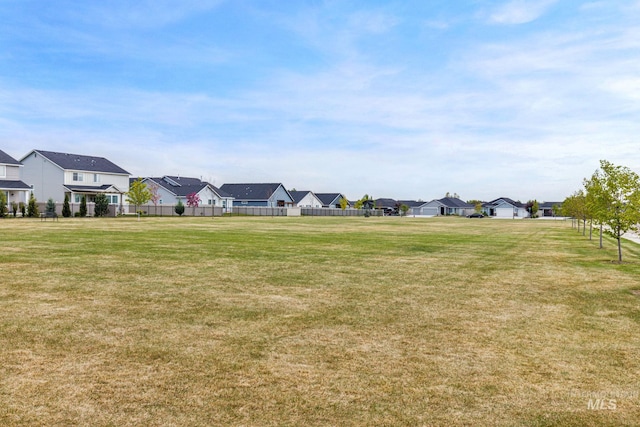 view of yard with fence and a residential view