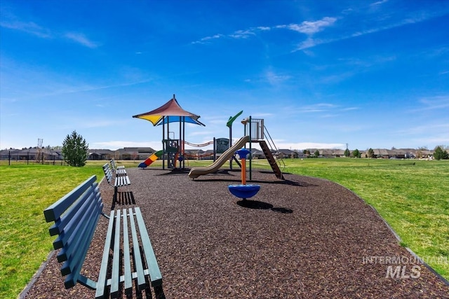 communal playground with fence and a yard