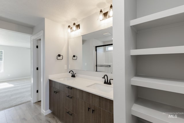 3121 S Carie Ave, Boise, ID 83709 - full bathroom with double vanity and baseboards