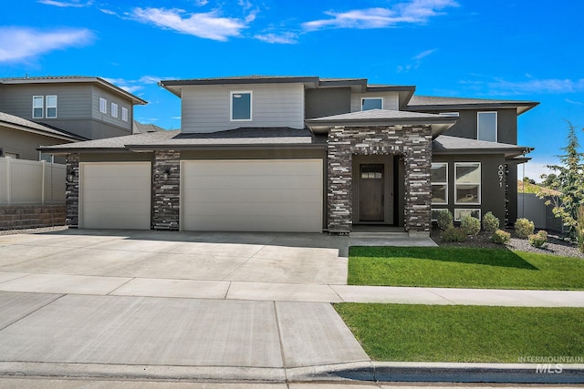 6071 S Pioneer Trail Way, Meridian, ID 83642 - prairie-style house with stone siding, concrete driveway, and an attached garage