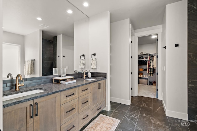 6071 S Pioneer Trail Way, Meridian, ID 83642 - full bathroom with double vanity, marble finish floors, a spacious closet, recessed lighting, and tiled shower