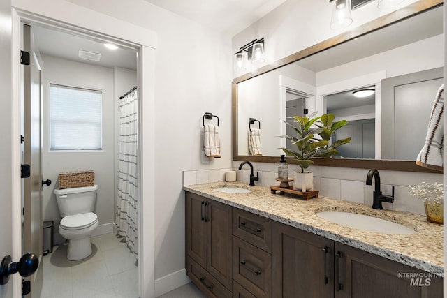 6071 S Pioneer Trail Way, Meridian, ID 83642 - bathroom with double vanity and tile patterned flooring