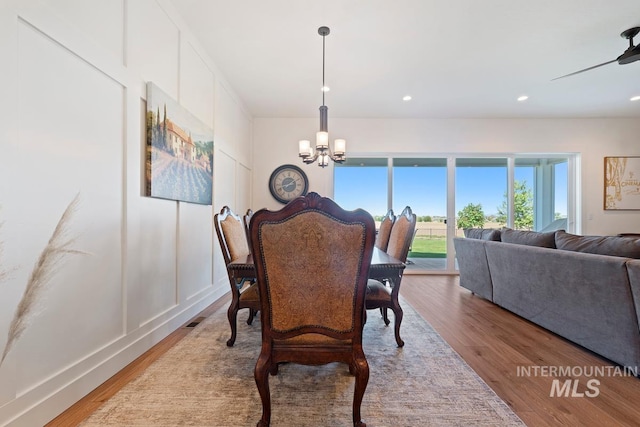 6706 Big Wood Way, Star, ID 83669 - dining space featuring a chandelier, wood finished floors, and recessed lighting