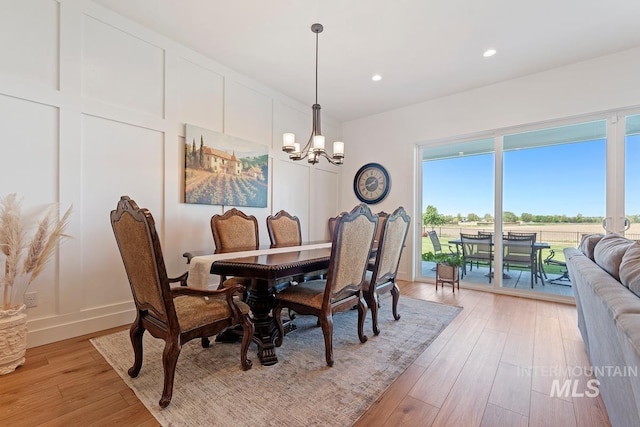 6706 Big Wood Way, Star, ID 83669 - dining space featuring a chandelier, light wood-style floors, recessed lighting, and baseboards