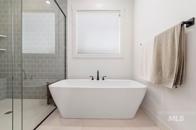 6706 Big Wood Way, Star, ID 83669 - full bath with a shower stall, a freestanding bath, and tile patterned flooring