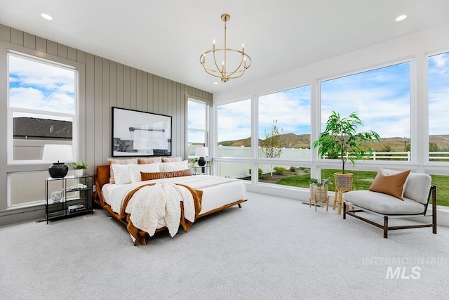 bedroom with an inviting chandelier, recessed lighting, carpet, and multiple windows