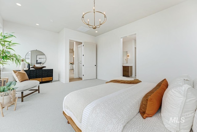 carpeted bedroom featuring ensuite bathroom, recessed lighting, and a chandelier