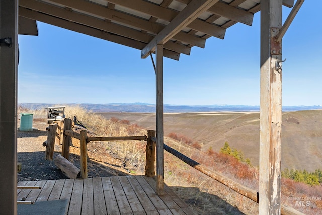 wooden terrace with a mountain view