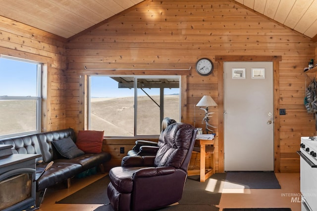 living room featuring wooden ceiling, wooden walls, and vaulted ceiling