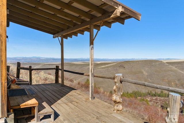 wooden terrace featuring a mountain view