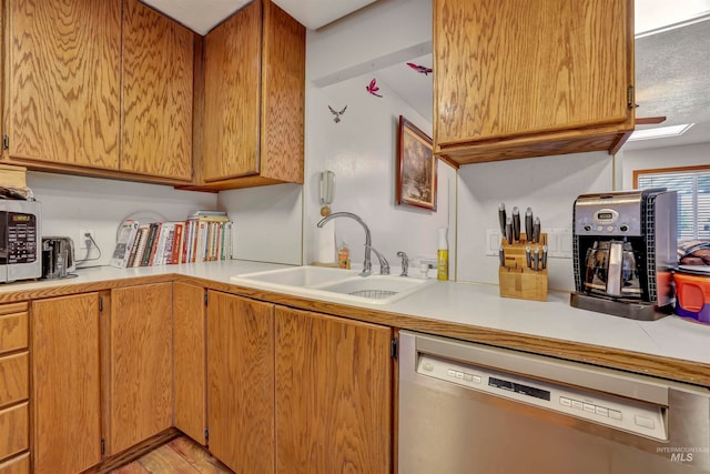 kitchen featuring sink and dishwasher